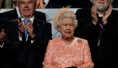 Queen Elizabeth wearing a peach dress at the 2012 Olympics