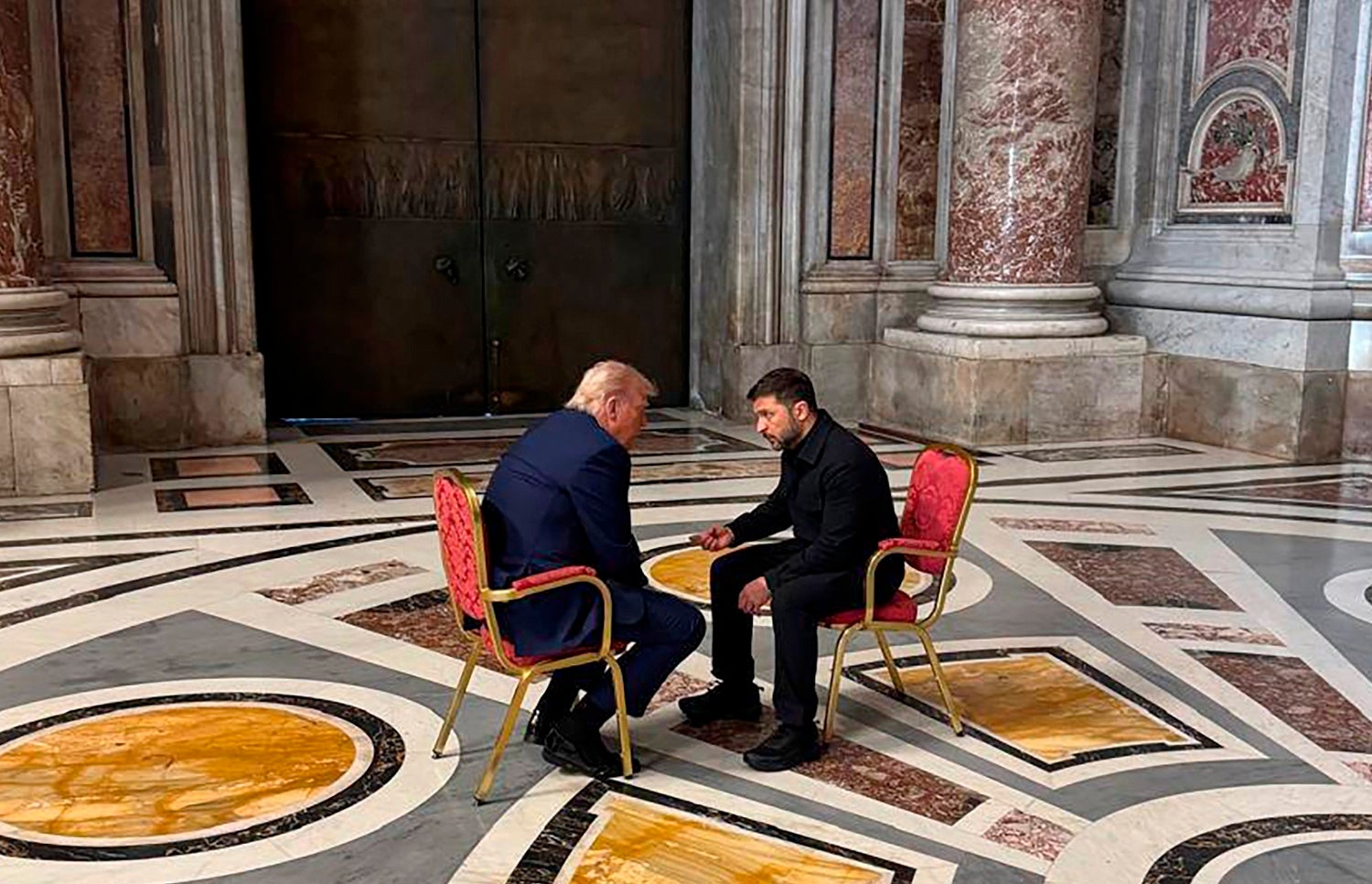 Ukraine's president Volodymyr Zelensky and president Donald Trump talk as they attend the funeral of Pope Francis in Vatican