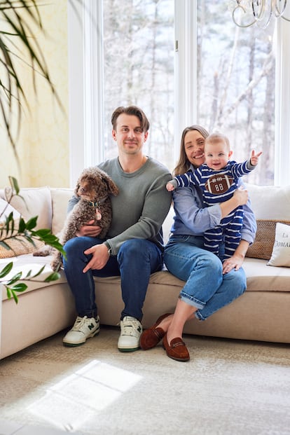 Melanson and Laura-Michèle G. Martin, with their son and dog, in the lounge of their country house hotel in Stanstead.