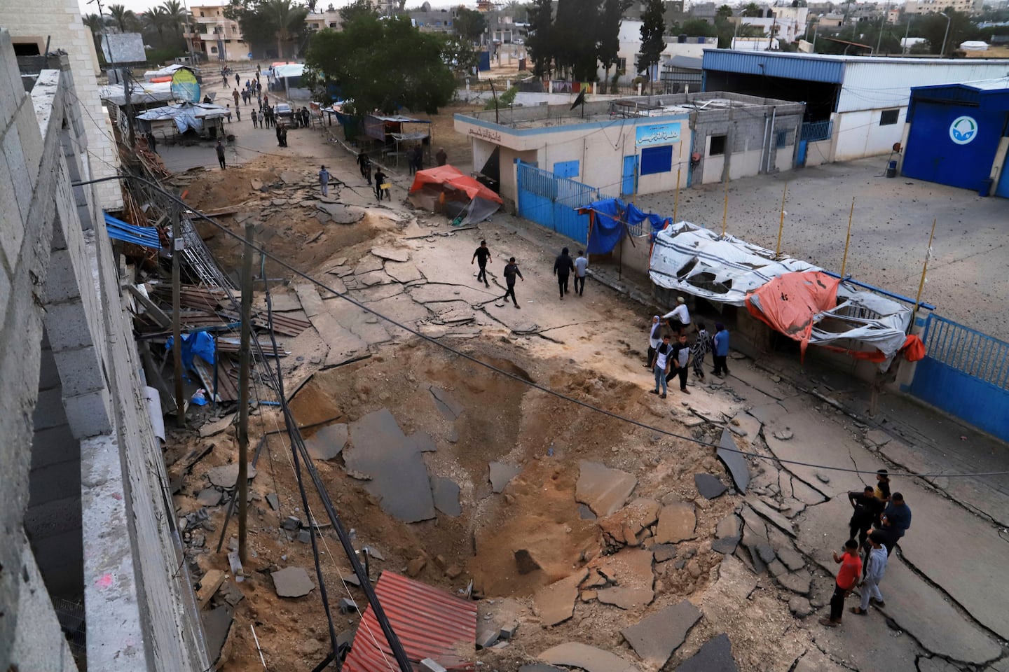 Palestinians inspected the site of an Israeli army airstrike on the European hospital in Khan Younis, Gaza Strip, on Tuesday.