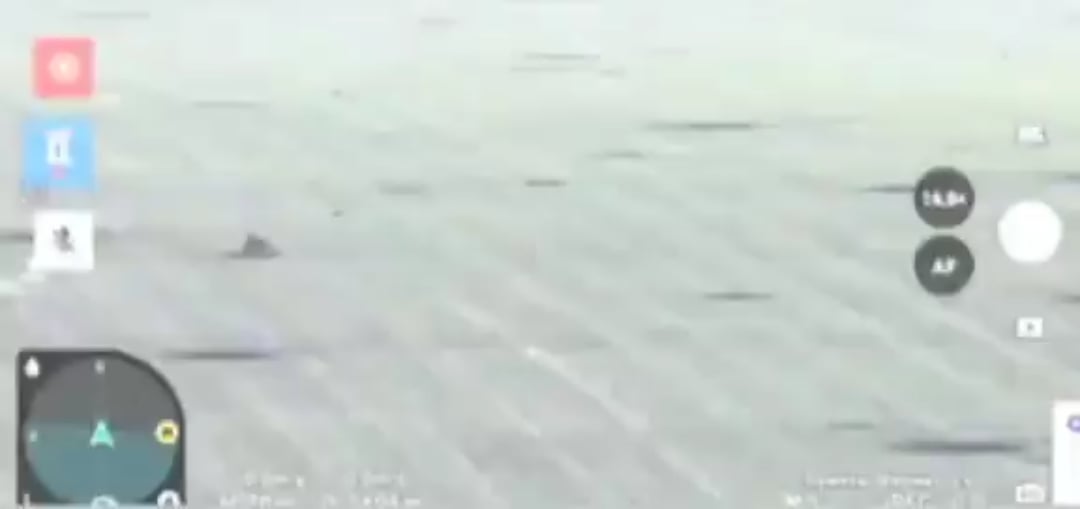 A Ukrainian drone watches as a russian infantry biker drives across a field and hit a mine.