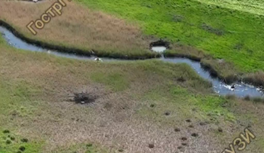 Ukrainian "Peaky Blinders" drone unit drops grenades on Russian military divers traversing a river in the Donetsk region, May 2025