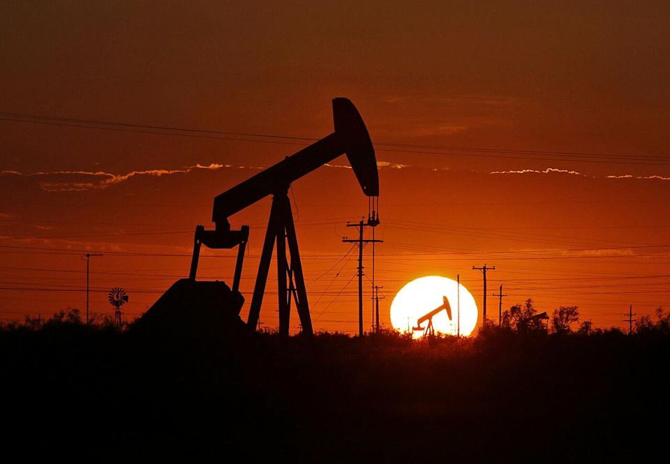 In this June 11, 2019, file photo a pump jack operates in an oil field in the Permian Basin in Texas. Drilling of the longest horizontal oil and gas well in the history of the Permian Basin has been completed as booming oil production in the region continues to center around shale in southeast New Mexico and West Texas.