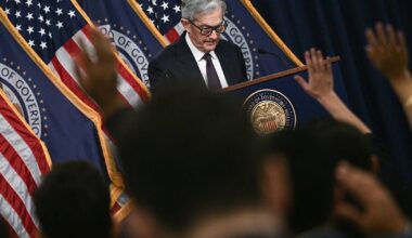 Fed holds rates steady, says tariffs will slow economy