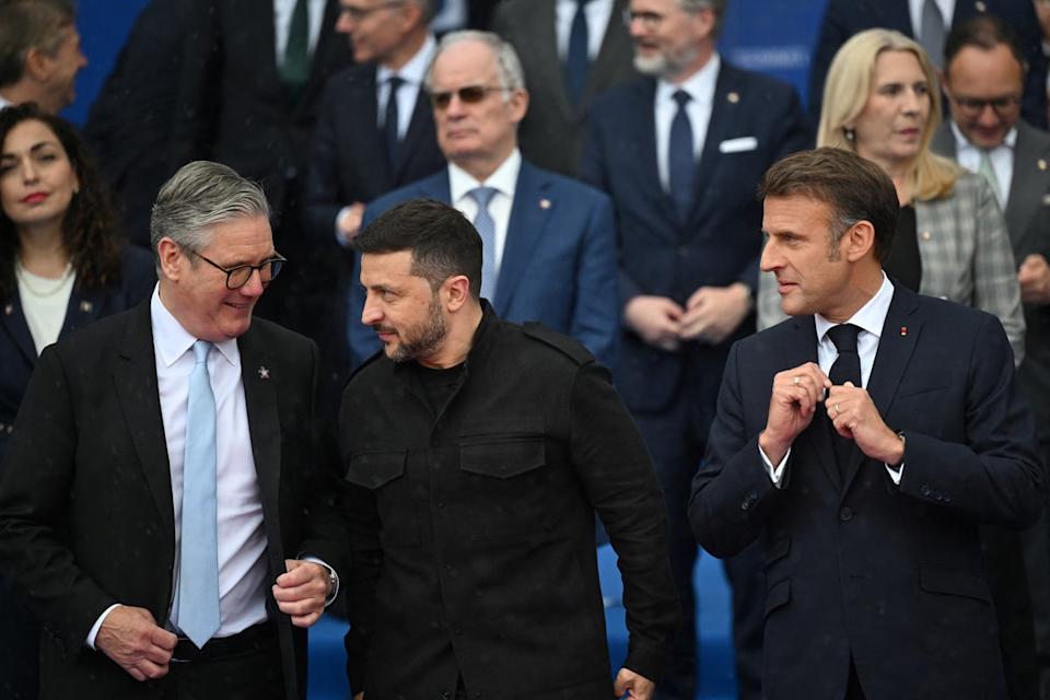 Volodymyr Zelensky, flanked by Keir Starmer and Emanuelle Macron (AFP/Getty)