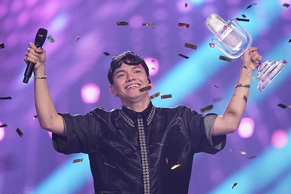 Winner of the Eurovision Song Contest JJ from Austria holds up the trophy (Martin Meissner/AP)