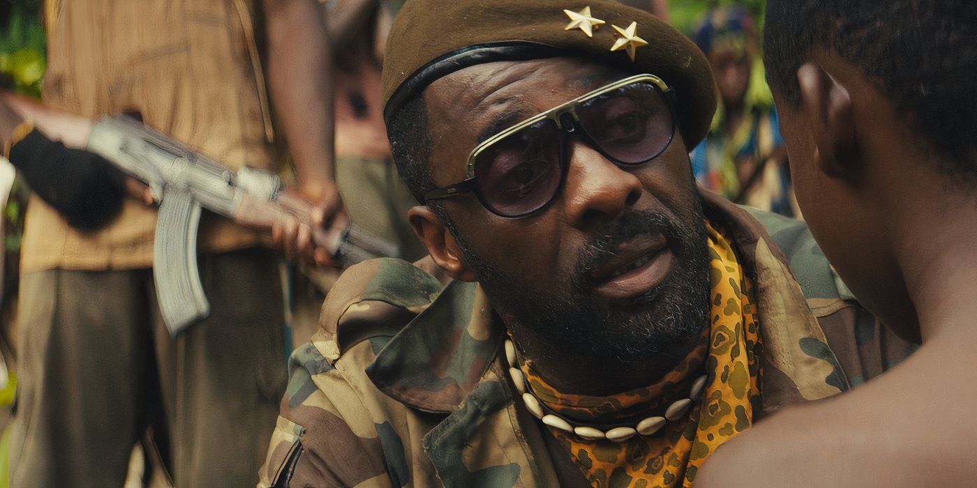 The Commandant talks to a child soldier while insurgents gather around them