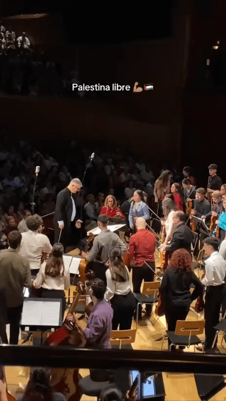 Amid warm applause from the audience, a Spanish orchestra conductor sheds tears after being wrapped in the Palestinian keffiyeh just before starting a performance in Las Palmas, a province of Spain’s Canary Islands. We should be proud of Spanish people standing against Genocide.