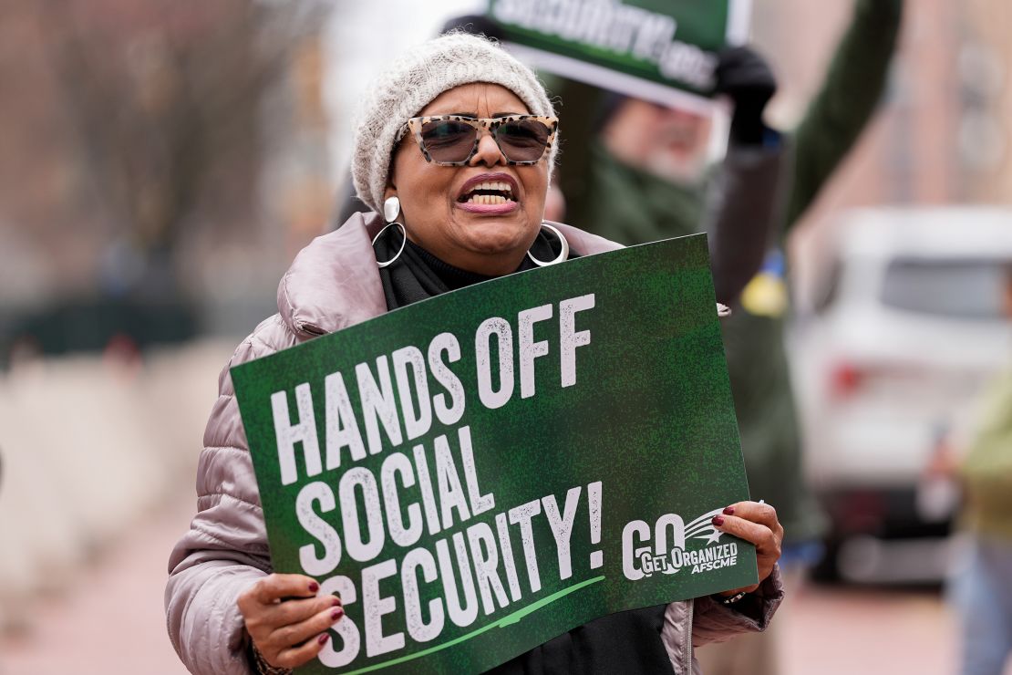 Demonstrators gather outside of the Edward A. Garmatz United States District Courthouse in Baltimore, Maryland, on March 14, before a hearing regarding the Department of Government Efficiency's access to Social Security data.
