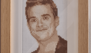 There's a wall in my house where we've hung cool posters, hand written song lyrics, framed keepsakes. Also my wife's middle school Robbie Williams cross stitch