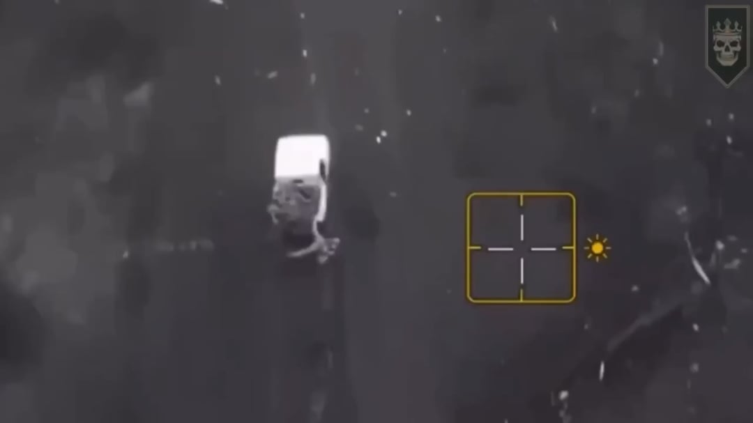 Russian soldiers fall off a car that drags razorwire behind it.