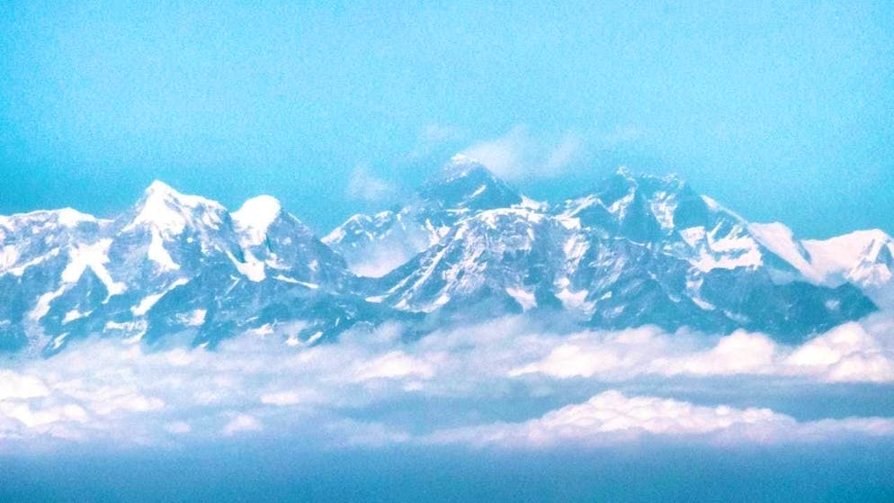 ARCHIVE - View from an airplane of the Himalayas with Mount Everest. Photo: Sina Schuldt/dpa