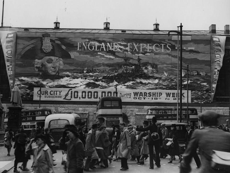 circa 1945: A huge poster, considered to be the largest in the world at the time, covering one side of Birmingham Town Hall, asking the city to raise 10,000,000 pounds during Warship Week in order to 'adopt' a battleship. (Photo by Fox Photos/Getty Images)