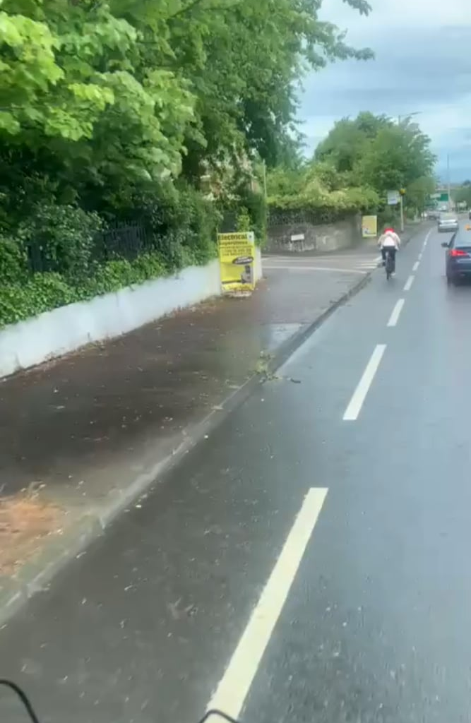 Dad and kid riding a bike