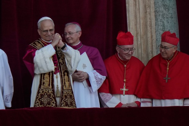 Pope Leo XIV appears on the balcony of St. Peter's...
