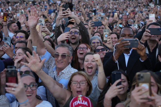 People react as the newly elected Pope Leo XIV he...