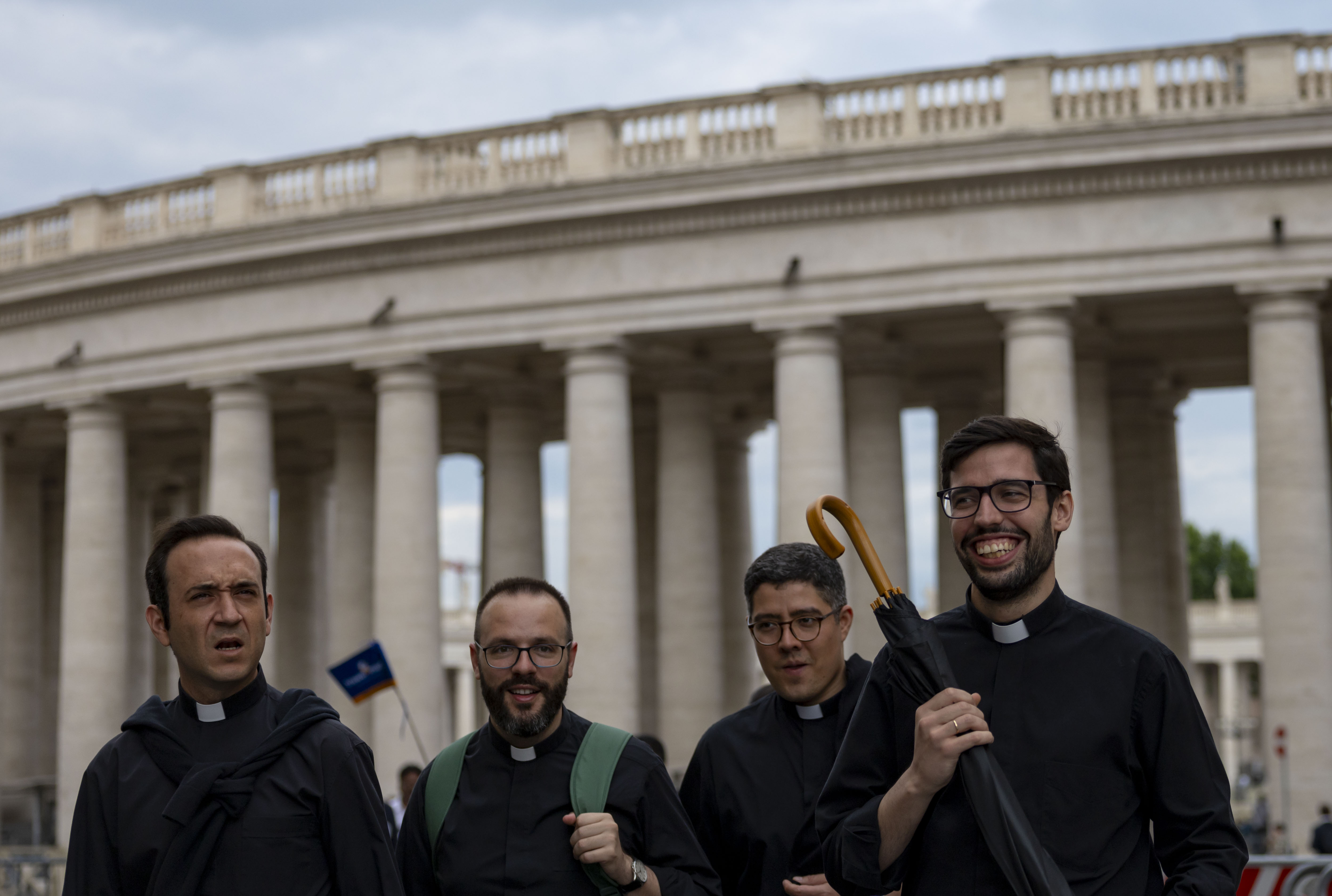 Priests walk by St. Peter's Square on Thursday, May 15, 2025, before the installation of Pope Leo XIV at the Vatican. (Brian Cassella/Chicago Tribune)