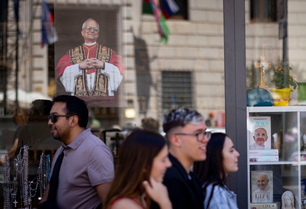 A photo of Pope Leo XIV is displayed in a...