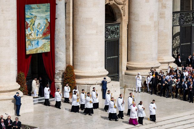 Pope Leo XIV is installed during Mass in St. Peter’s...