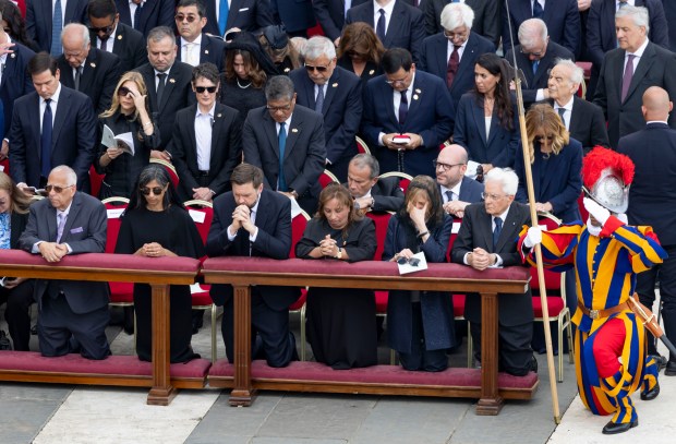 The brother of Pope XIV, Louis Prevost, far left, kneels in...