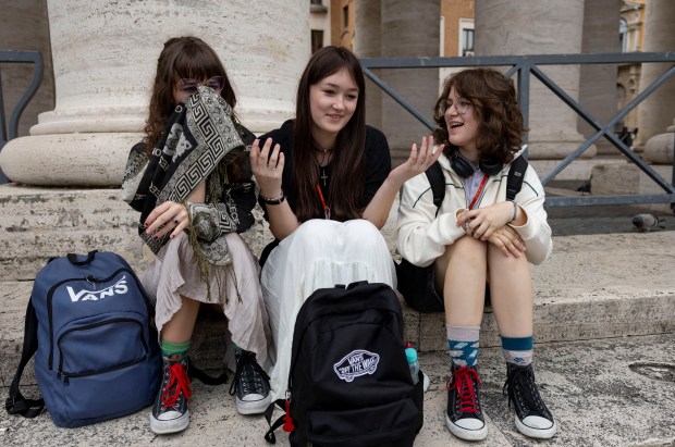 Maria Izworska, center, and Weronika Kotarba, right, of Poland, visit St. Peter's Square on May 20, 2025, at the Vatican. (Brian Cassella/Chicago Tribune)