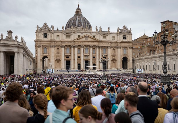 People watch while Pope Leo XIV holds his first general audience, May 21, 2025, in St. Peter's Square at the Vatican. (Brian Cassella/Chicago Tribune)