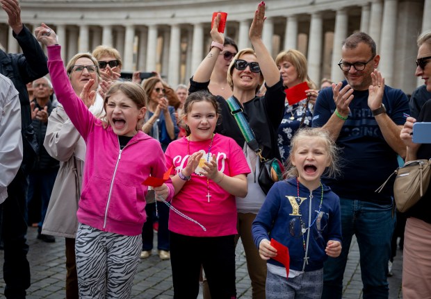Children cheer after Pope Leo XIV held his first general audience on May 21, 2025, in St. Peter's Square at the Vatican. (Brian Cassella/Chicago Tribune)