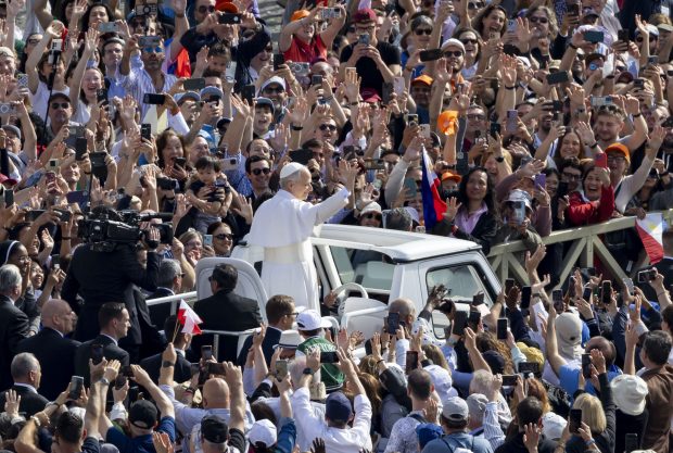 Pope Leo XIV waves to the crowd as he arrives for his installation Mass in St. Peter's Square on May 18, 2025, at the Vatican. (Brian Cassella/Chicago Tribune)