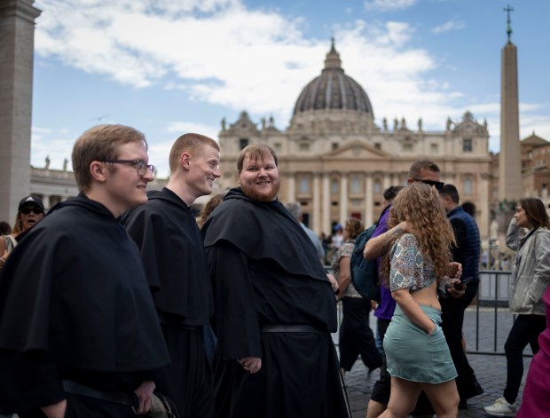 Augustinian friars Brother David Relstab, from left, the Rev. Jack Tierney and the Rev. Joe Roccasalva visit St. Peter's Square in Rome on May 17, 2025, before the installation of Pope Leo XIV at the Vatican. Relstab is a teacher at Providence Catholic in New Lenox, Tierney is a former teacher at St. Rita in Chicago and Roccasalva grew up in Beverly and attended Marian Catholic. (Brian Cassella/Chicago Tribune)