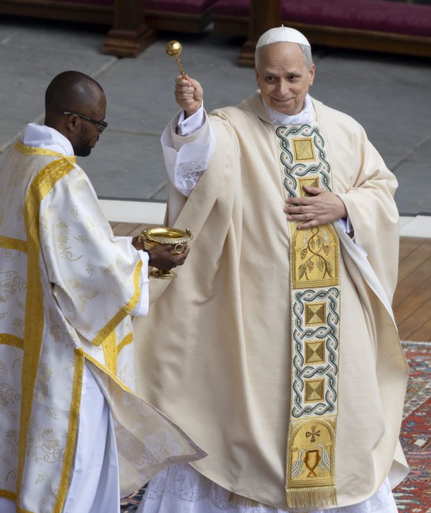 Pope Leo XIV blesses the crowd with holy water during his installation Mass in St. Peter's Square on May 18, 2025, at the Vatican. (Brian Cassella/Chicago Tribune)