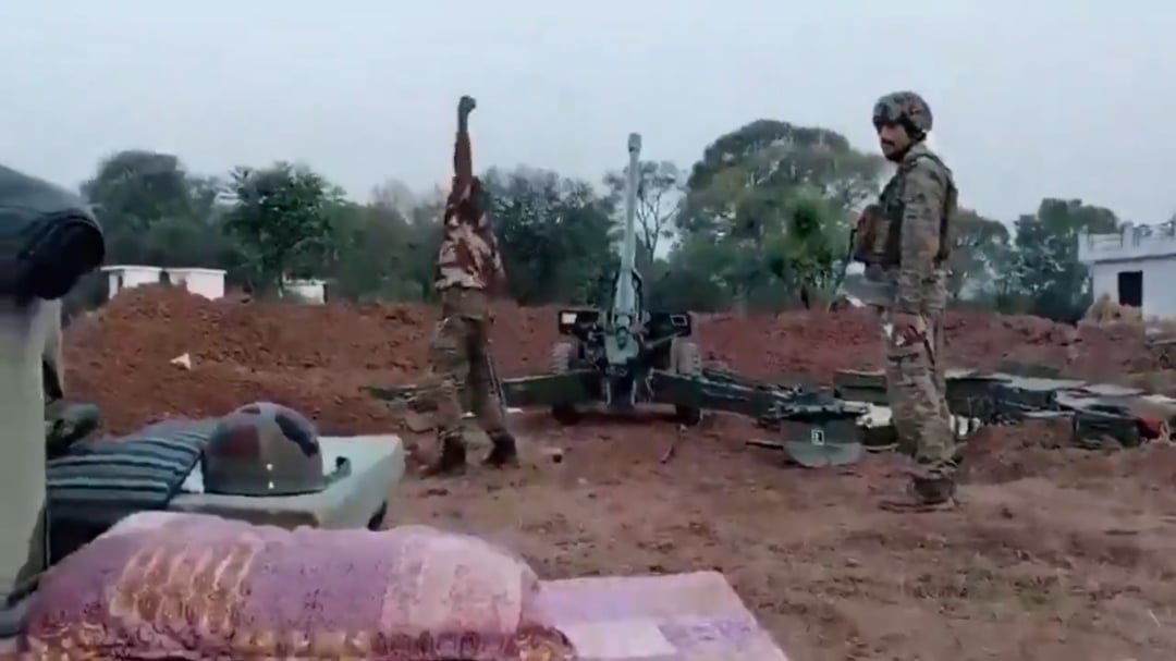 A Indian artillery battery of 130mm M-46's fires a volley at Pakistani army postions on the line of contact.