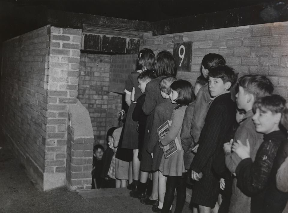 Brixton Children Have Their Own Public Library in an Air-Raid Shelter, 1945. Air-raid shelters can be put to many uses, now that their primary purpose no longer applies. These photographs were taken at Shelter 9, on the Cowley Estate, Brixton, where Lady Margaret Hall Settlement runs a library for the children of the Cowley Estate. Planet News. (Photo by Daily Herald Archive/National Science & Media Museum/SSPL via Getty Images)