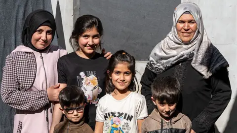 Rolf Andreason/BBC Fatima on the right, pictured with her family