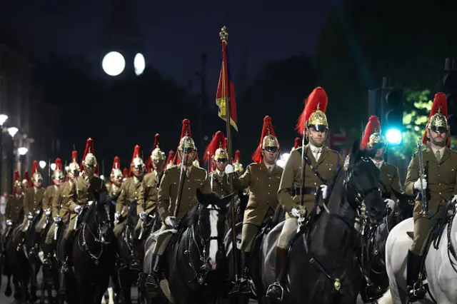 Members of the Household Cavalry take part in an overnight rehearsal for the VE Day 80 procession on Whitehall in central London