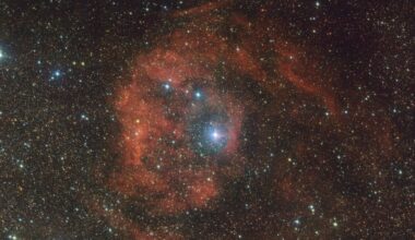 Cosmic imposter bathes distant nebula in fiery red glow: 'This star should not be here'