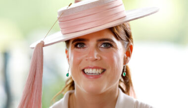 Princess Eugenie wearing a pink hat and smiling
