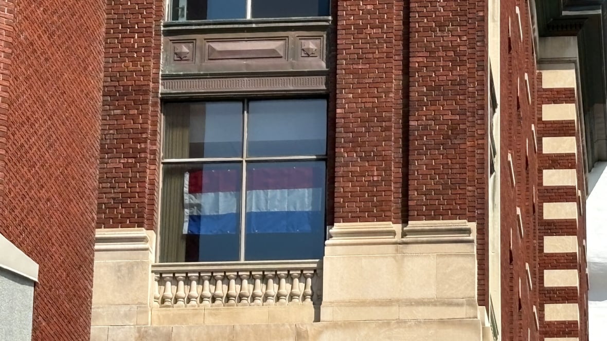Dutch flag flies in the window of the Civic campus of the Ottawa Hospital.