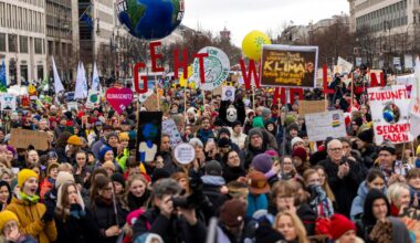 people marching holding signs