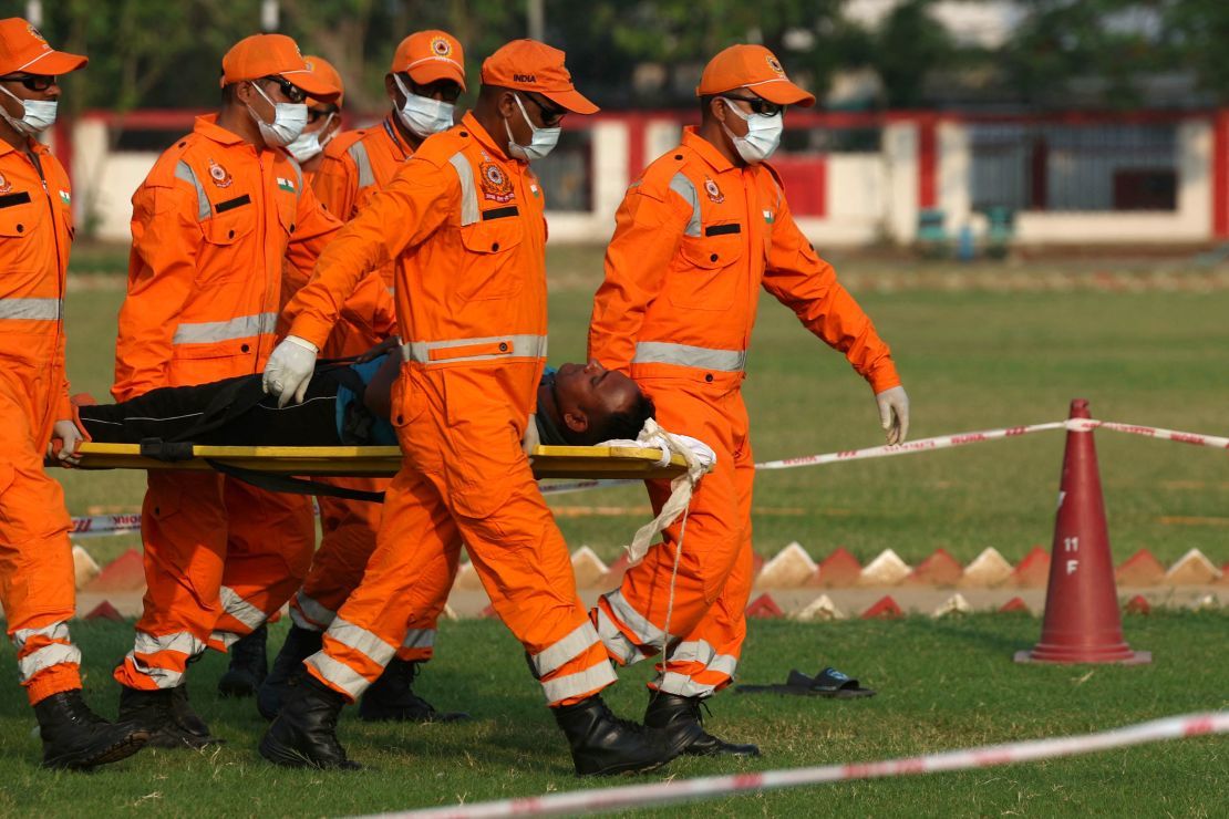 National Disaster Response Force personnel take part in the nationwide civil defense mock drill in Varanasi on May 7, 2025.