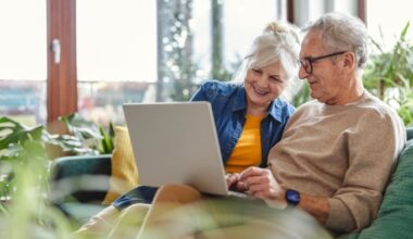 Senior couple using laptop