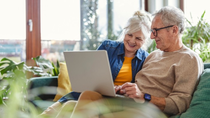 Senior couple using laptop