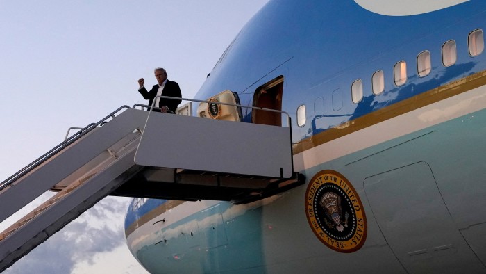 US President Donald Trump pumps his fist as he disembarks from Air Force One at Palm Beach International Airport in Florida on Sunda