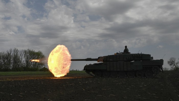 A Ukrainian tank crew of the 33rd Separate Mechanised Brigade fire a round from a Leopard 2A4 tank during a field training exercise at an undisclosed location in Ukraine on April 30 2025