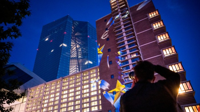 The headquarters of the European Central Bank stands illuminated in a rehearsal prior to the 75th anniversary of the Schuman Declaration on May 08, 2025