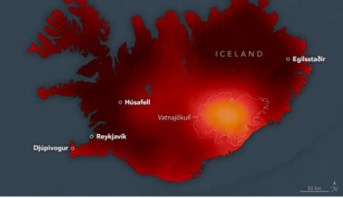 Air temperatures are displayed on a map of Iceland. Cooler areas appear yellow to orange, and warmer areas appear red to dark red. Except for the ice caps near the middle and lower right of the island, which appear orange, most of the island is dark red.