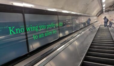 John Lewis ad at Oxford Circus, as people head out of the Ikea exit