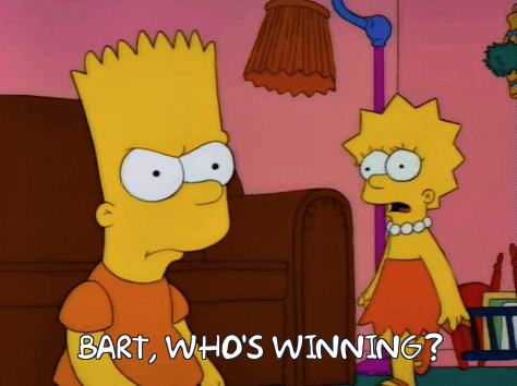 A still image from The Simpsons shows Lisa asking an annoyed Bart "who's winning".