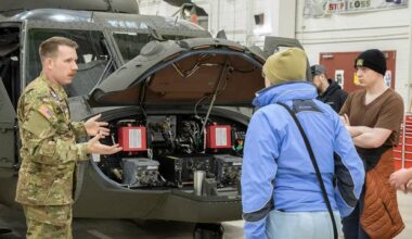UH-60 Blackhawk crew chief speaks with high school students