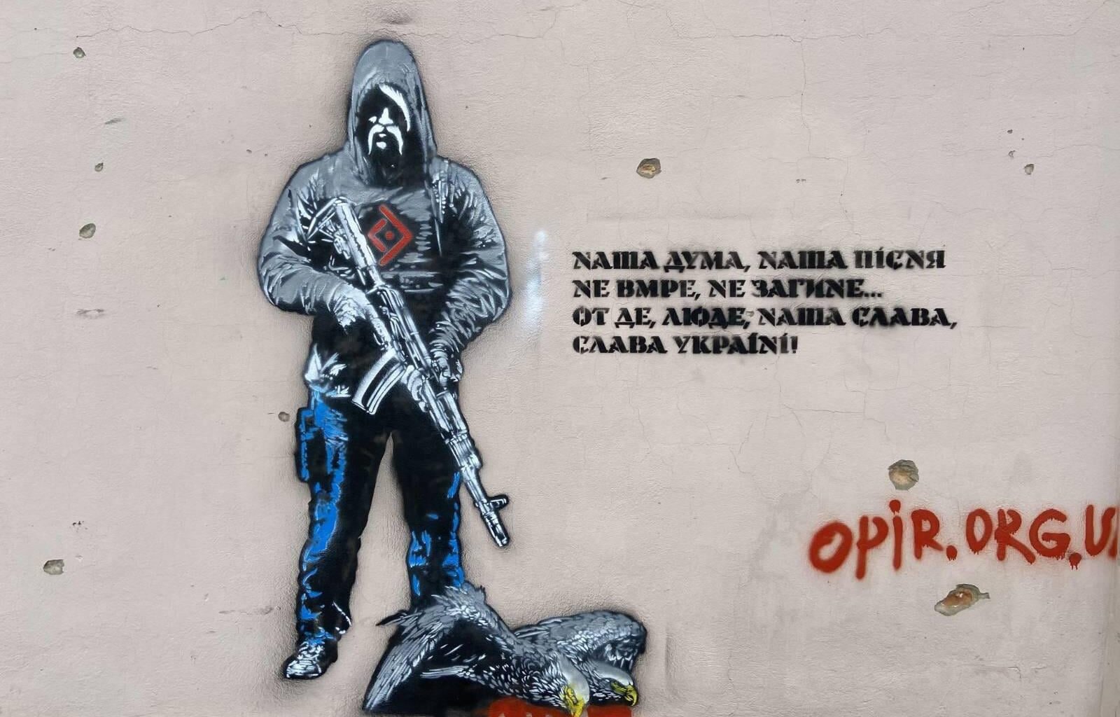 Murals depicting a Ukrainian warrior and a slain Russian double-headed eagle. In war-torn Orikhiv, Zaporizhzhia region, 5 km from the frontline, Ukrainian artists create powerful murals on walls of buildings destroyed by Russia as symbols of resistance, resilience. Artists Yermolenko, Titov, Bryliov