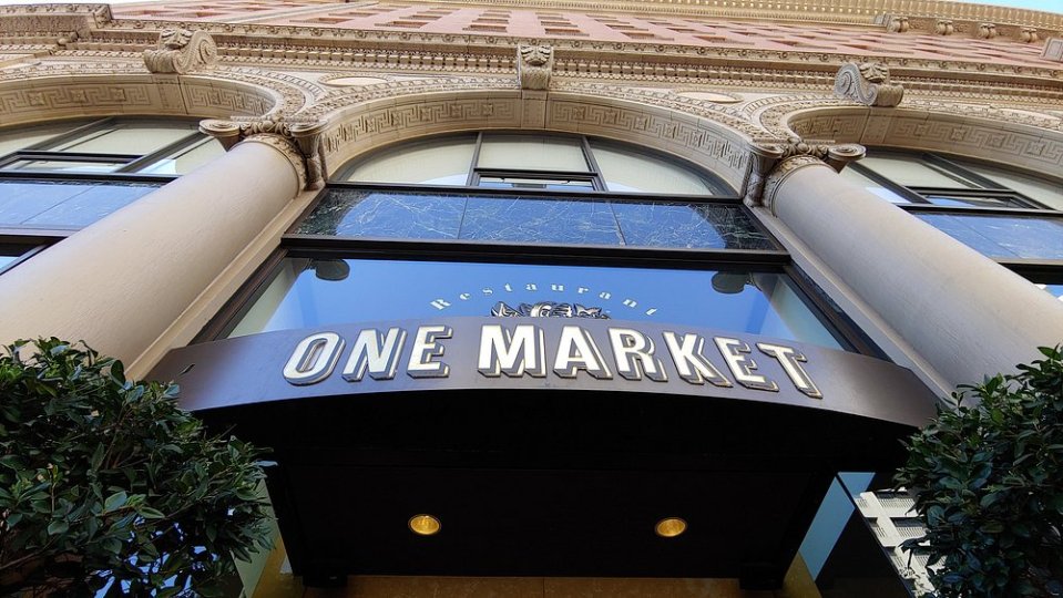 One Market Restaurant sign on building facade.